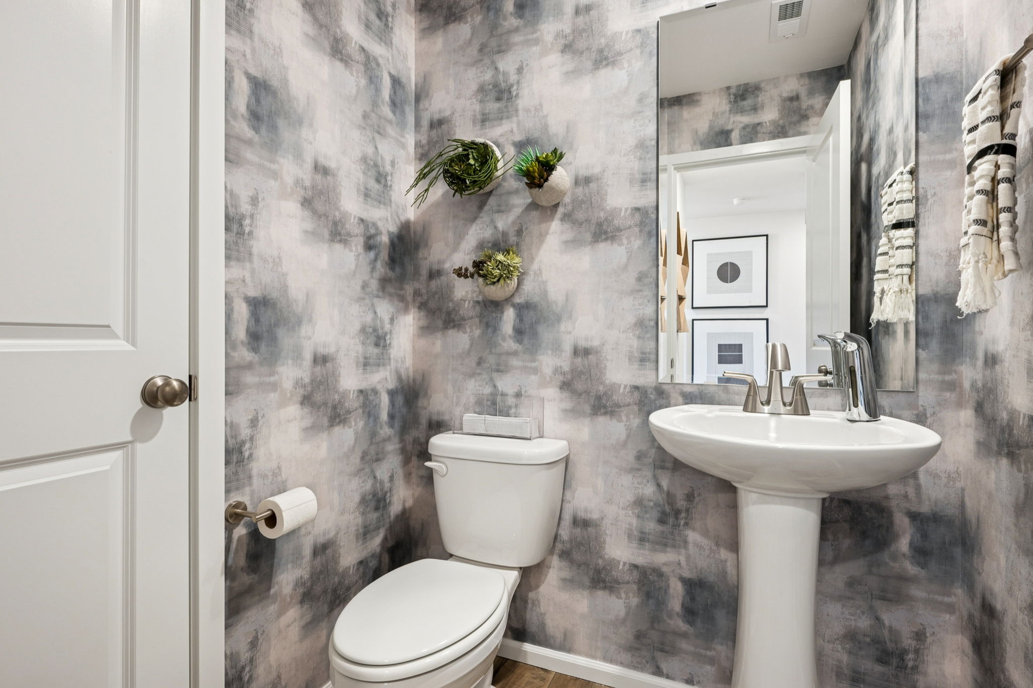 A bathroom with a toilet and sink.