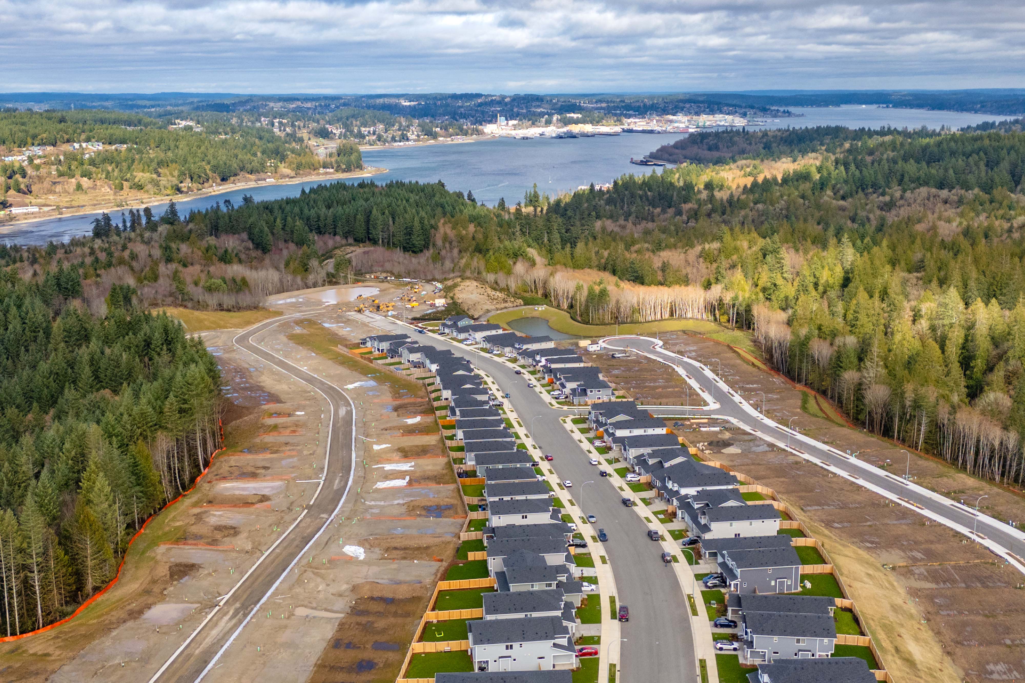 A highway with a river and trees.