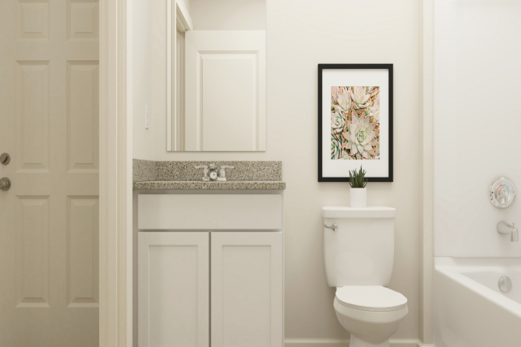 A bathroom with a toilet and a sink.