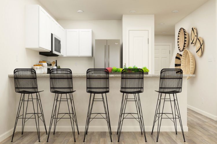 A kitchen with stools and a table.