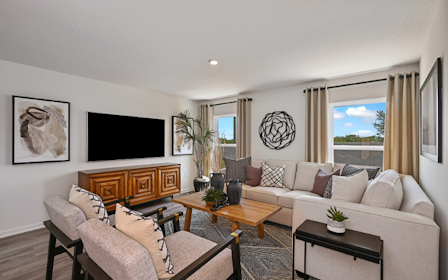 A living room with a couch and a tv.