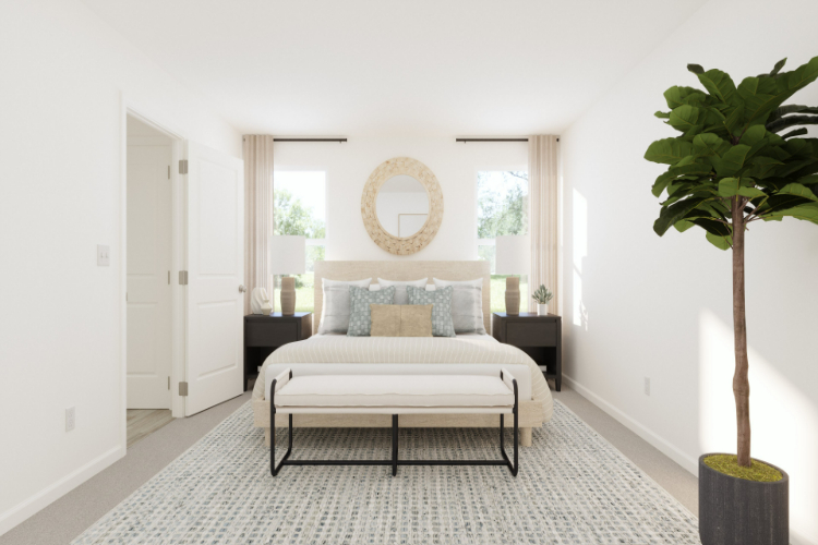 A bedroom with a bed and a table.