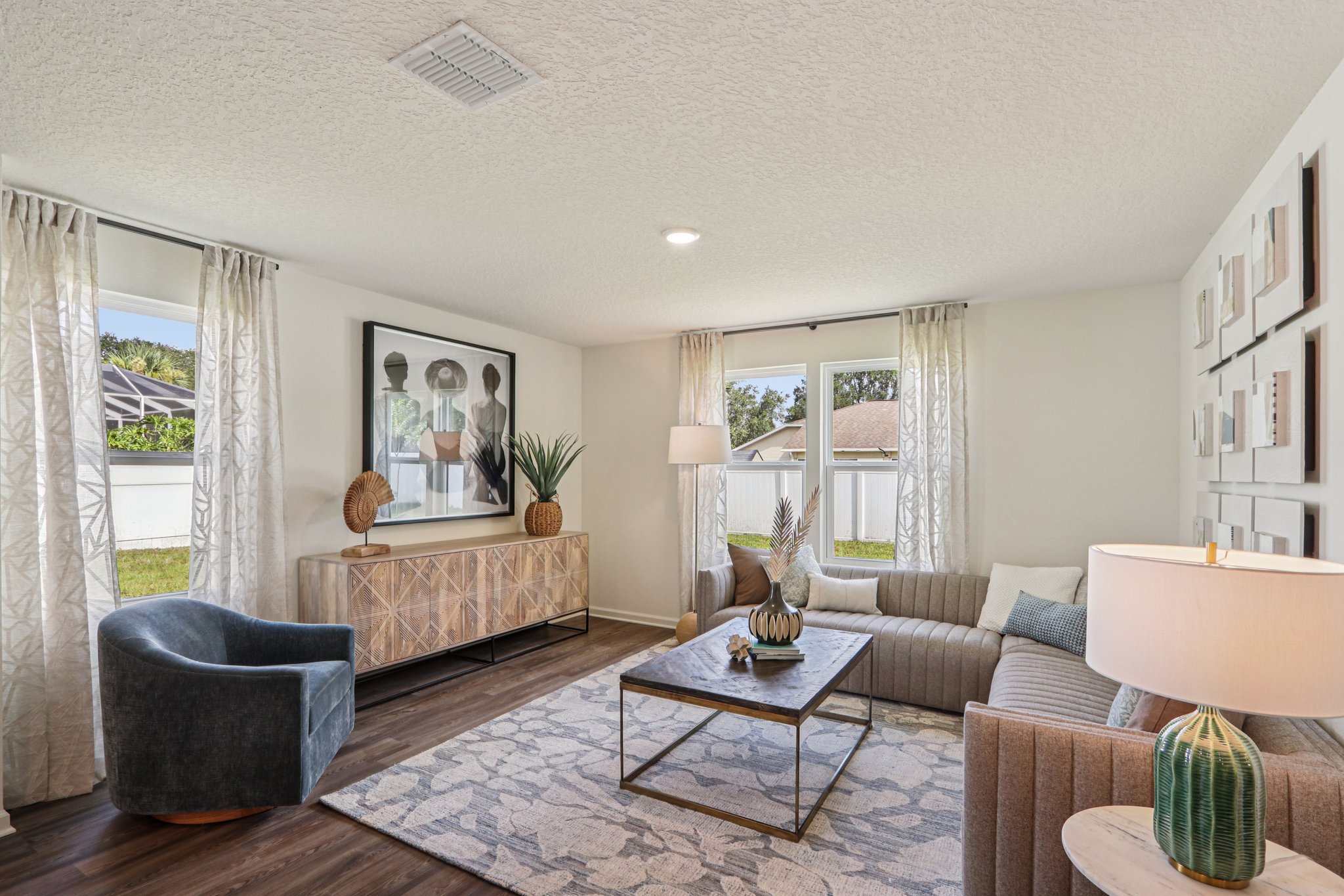A living room with a couch and a table.