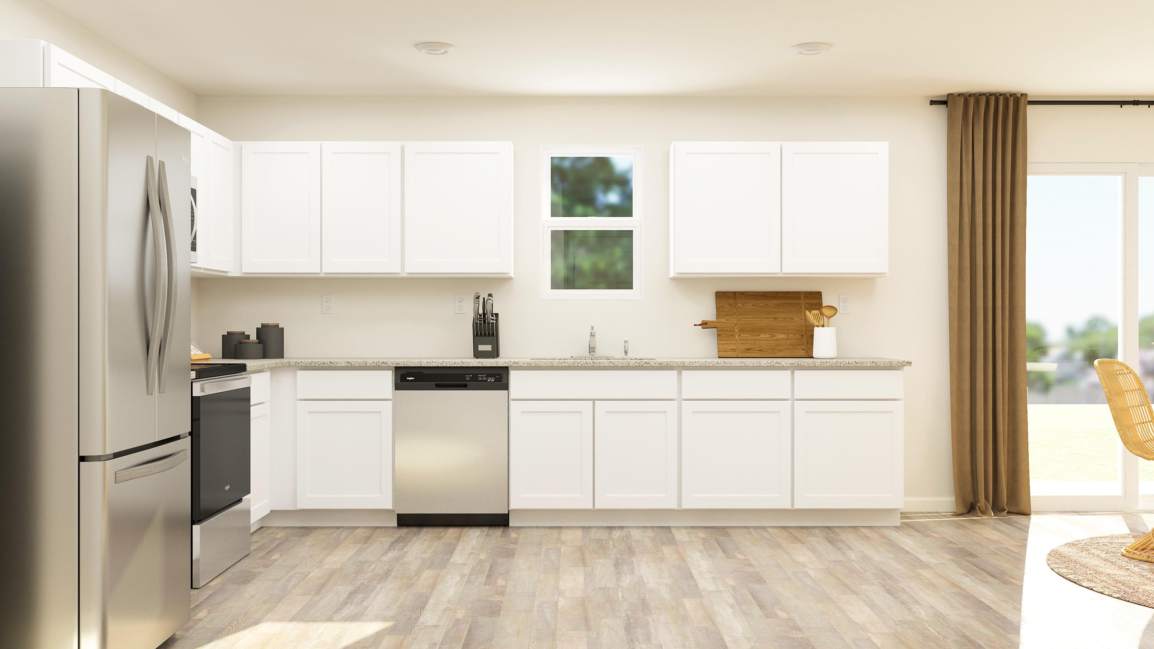 A kitchen with white cabinets.