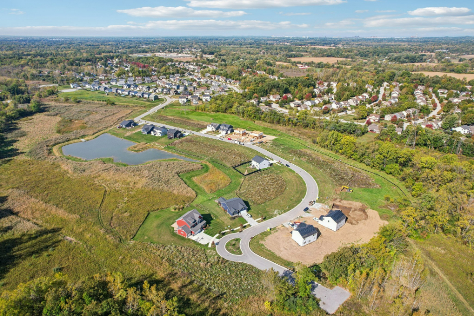 A landscape with houses and trees.