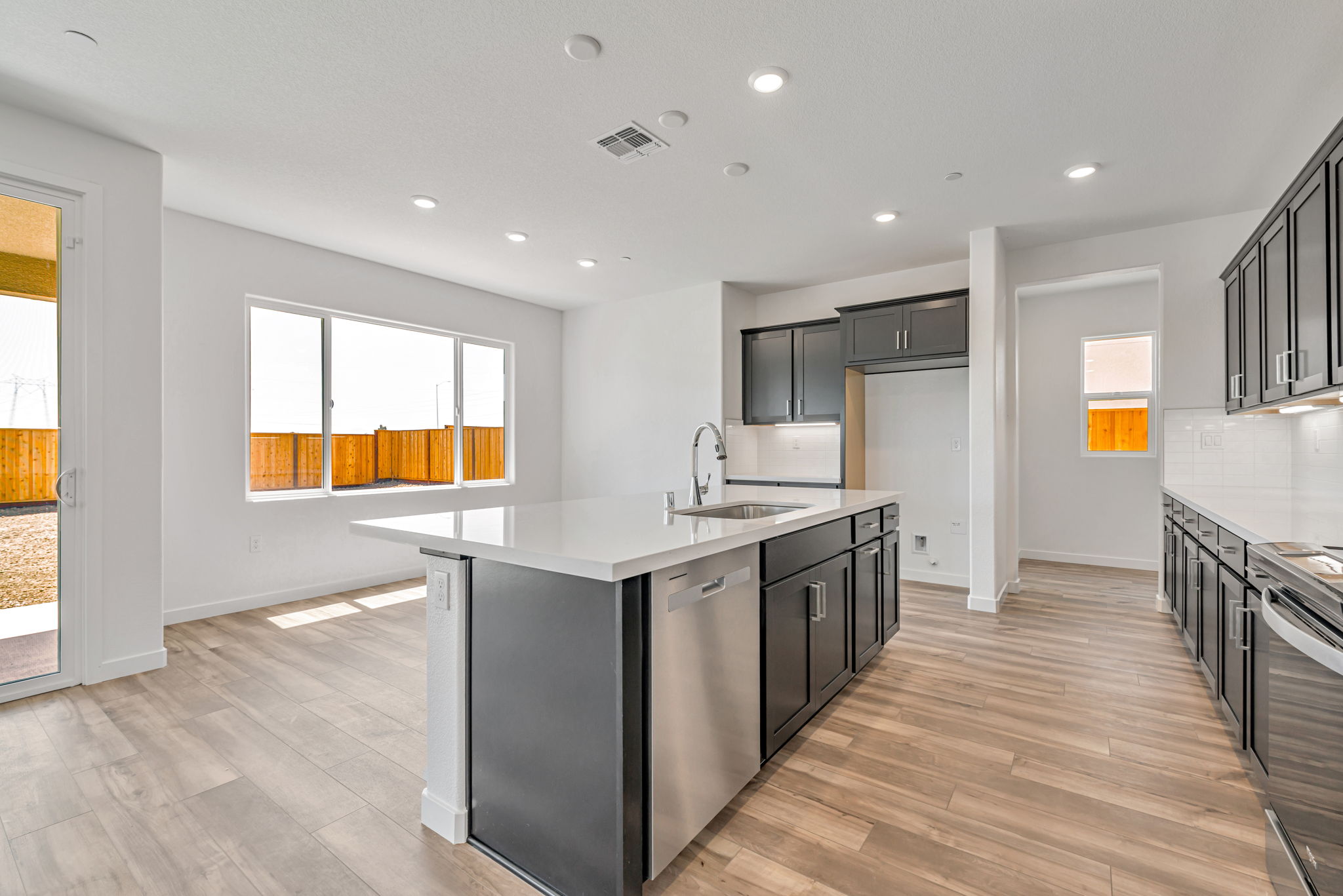A kitchen with black appliances.